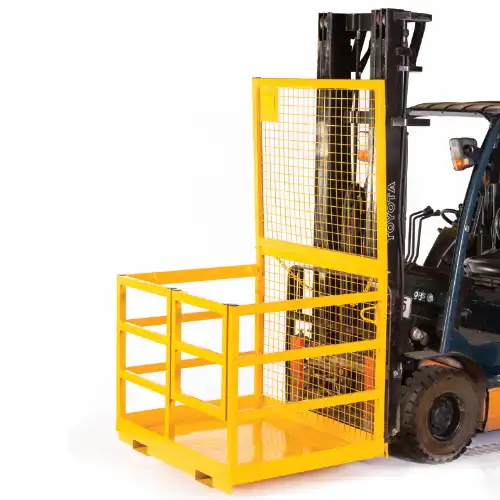 yellow steel man cage being lifted by a forklift