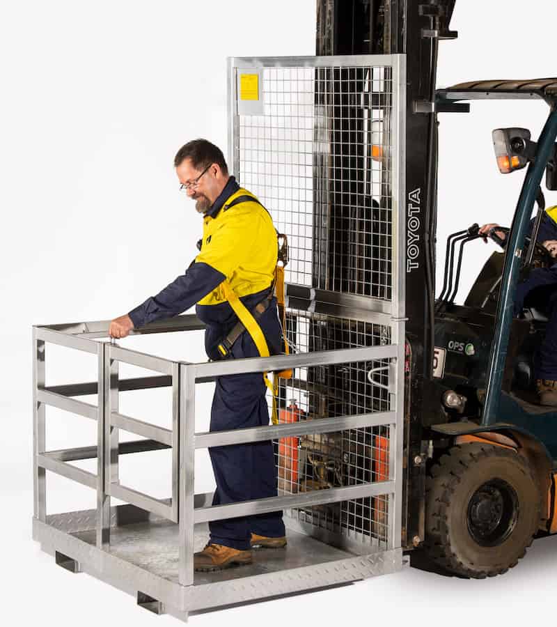 man standing in a safety gate, about to open the cage
