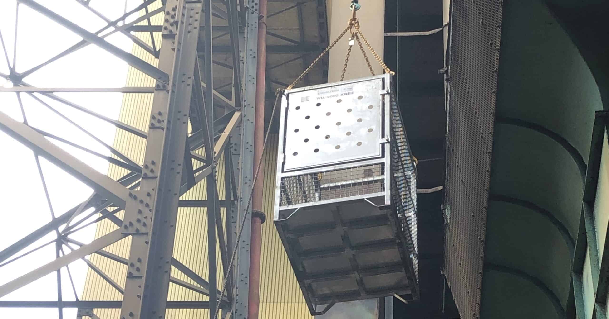 crane lifting cage in use
